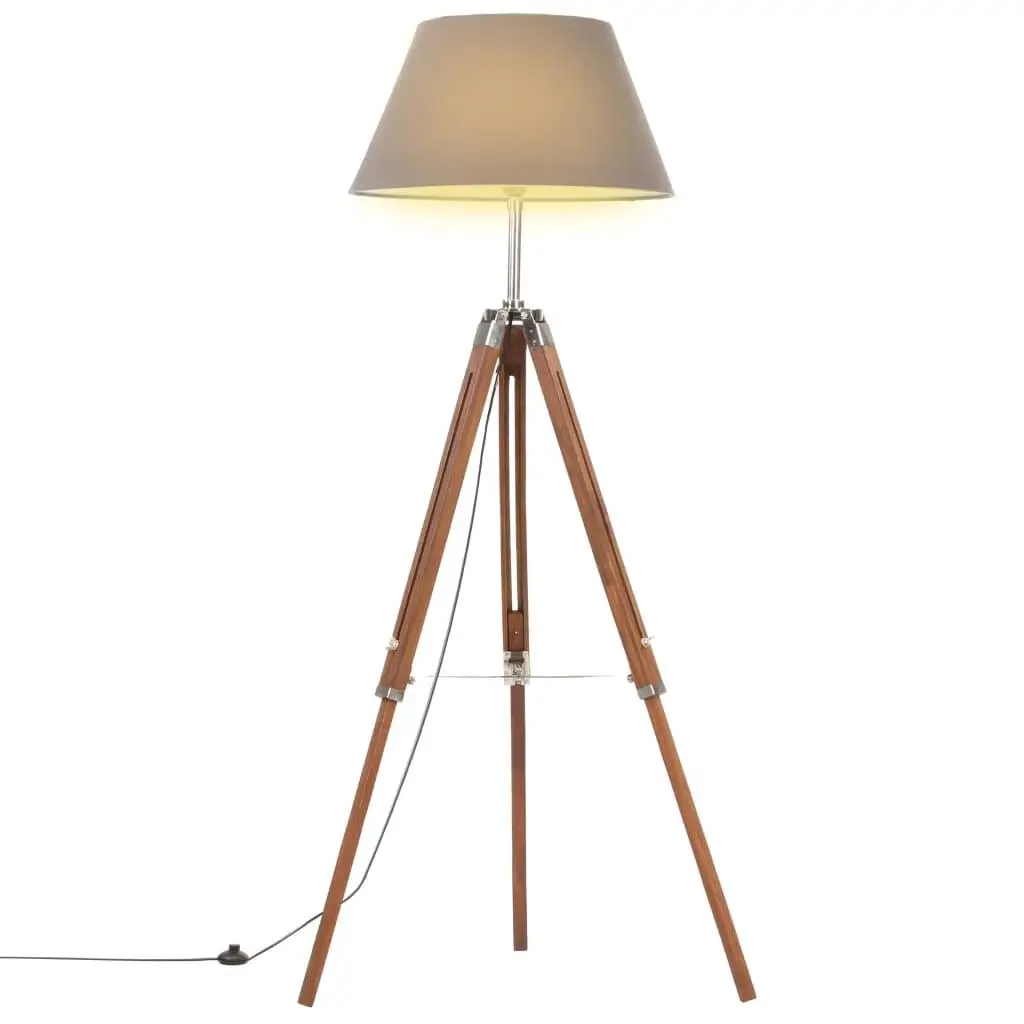 Lampadaire trépied bois de teck avec abat-jour gris dans un salon moderne