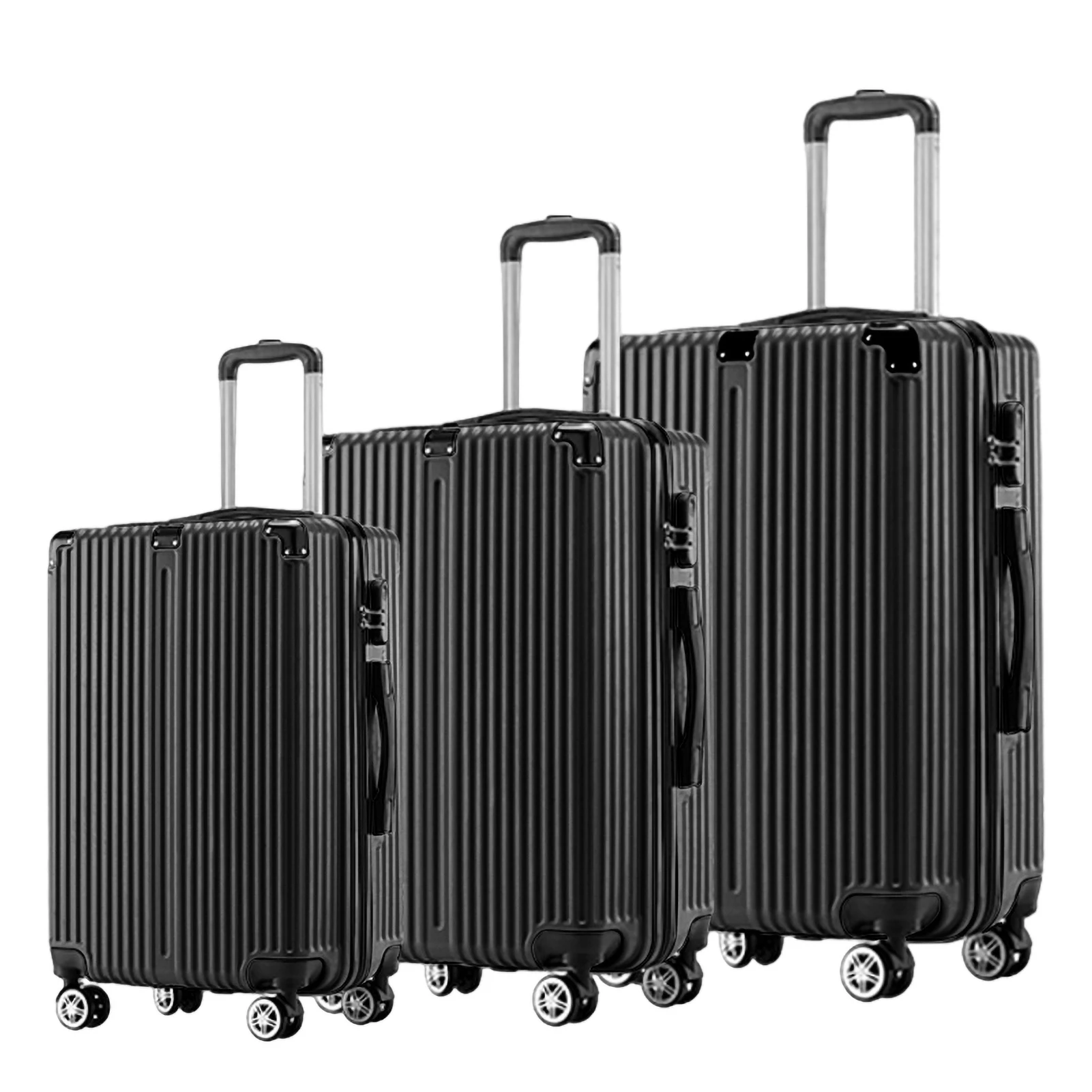 Trois valises noires en ABS empilées, illustrant les différentes tailles
