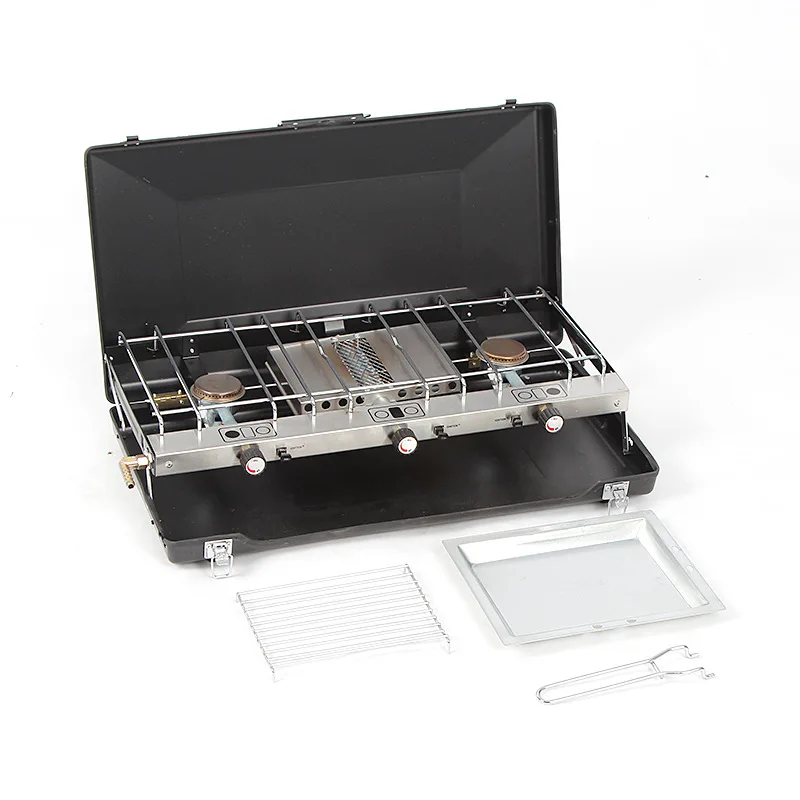 Réchaud camping avec pare-brise protégeant la flamme