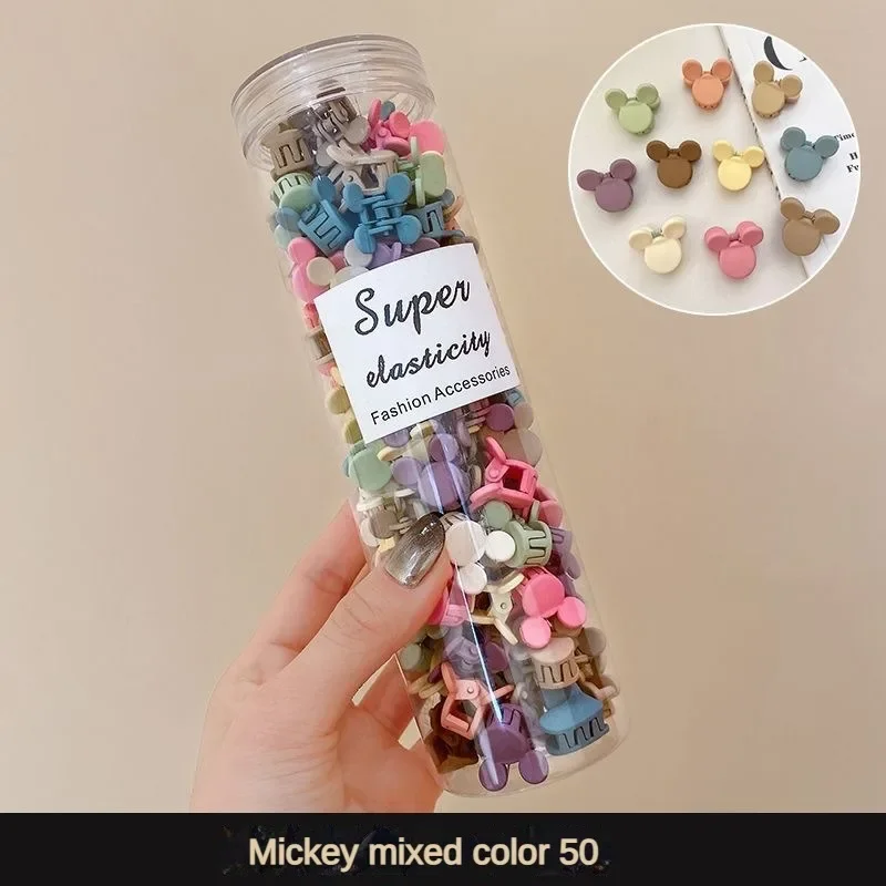 Boîte de 50 mini pinces à cheveux bonbons sur fond clair