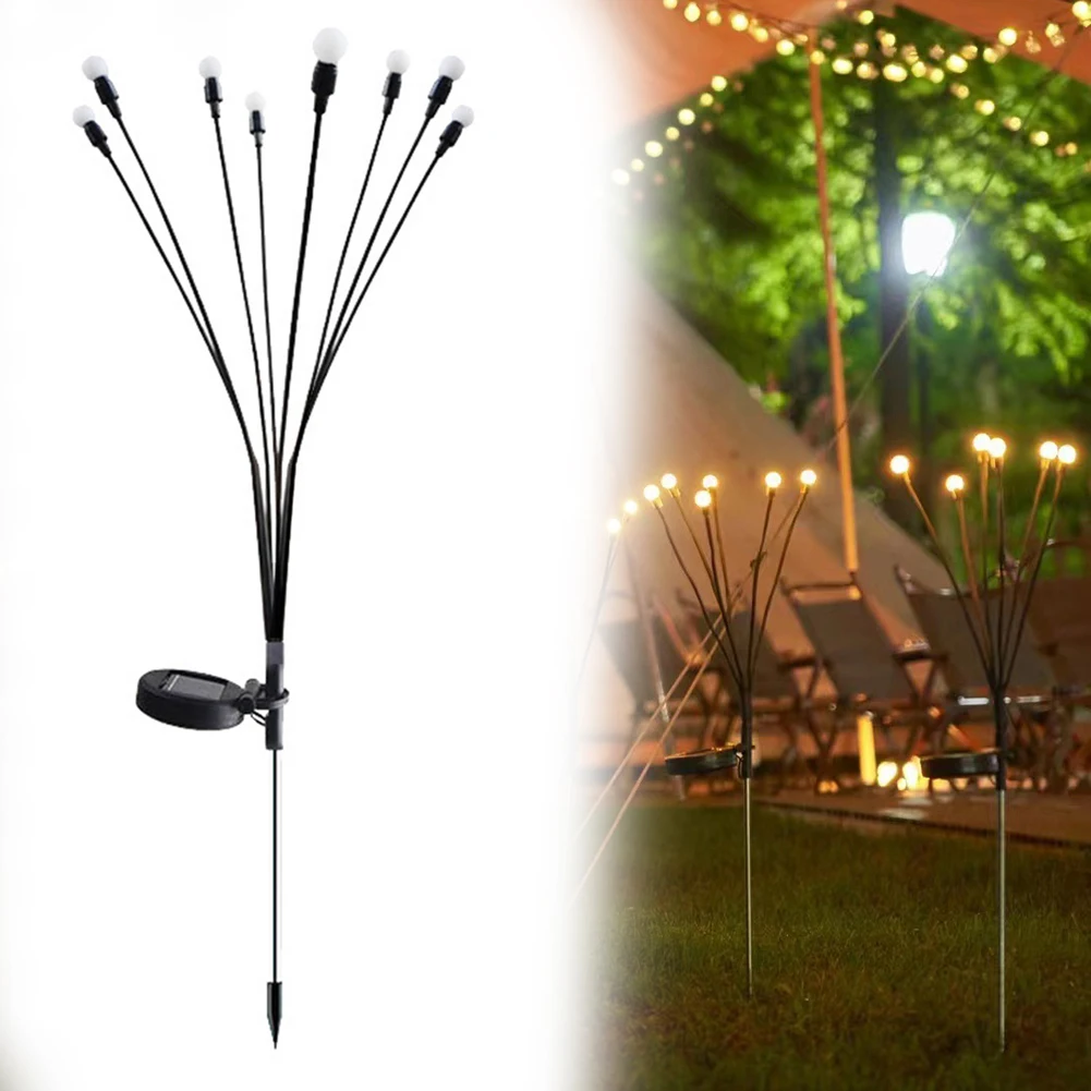 Lampes solaires lucioles illuminant une allée de jardin