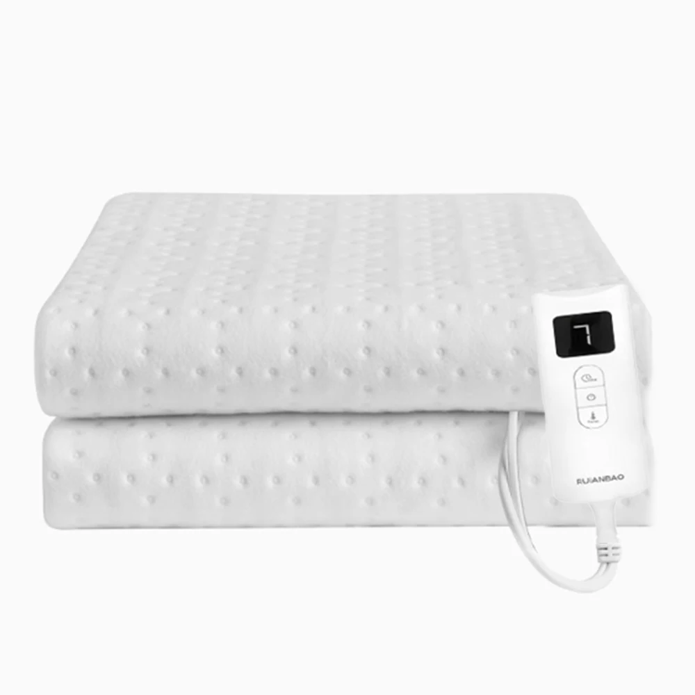 Personne recouverte d'une couverture chauffante double